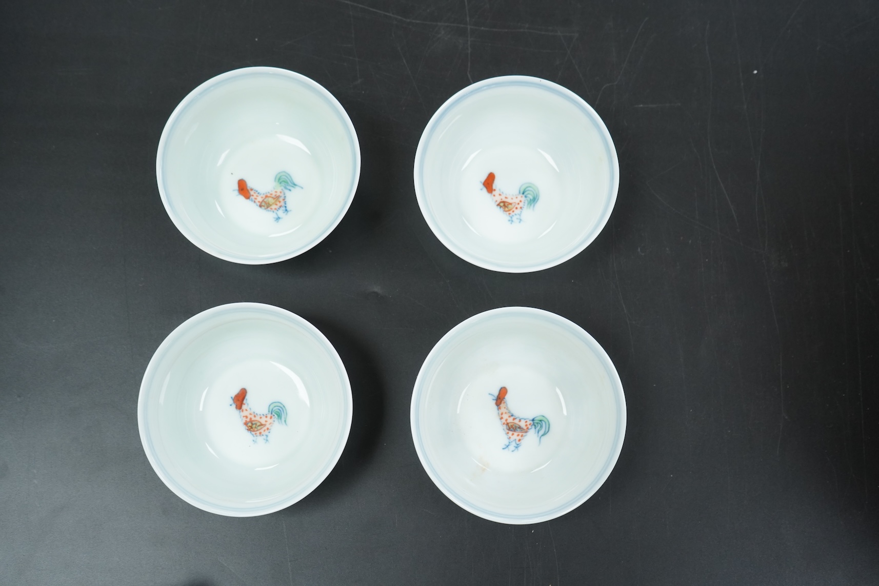 Four Chinese porcelain Wucai tea bowls, 8cm in diameter